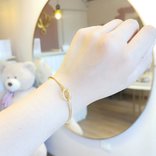 BRAZALETE NUDO DORADO