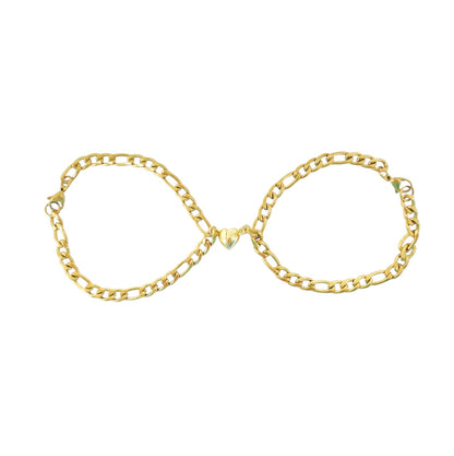 PULSERA CON CORAZONES MAGENTICOS DORADA